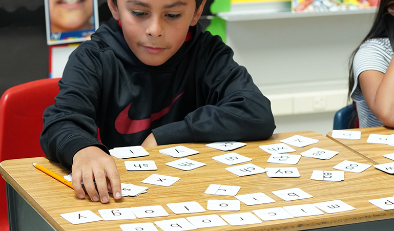Child using Readiness & Writing